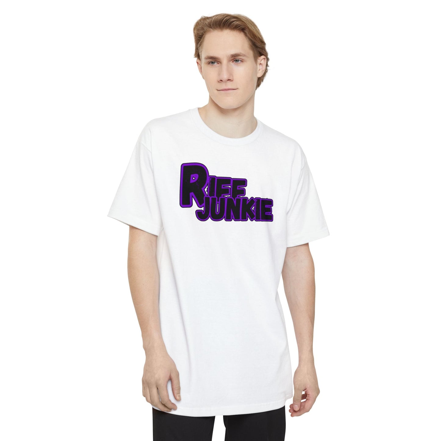 A man wearing a black Riff Junkie Logo Stage Lights Edition Tall Fit white t-shirt featuring a glowing purple guitar-inspired logo on the front, designed with extra length for a comfortable fit.