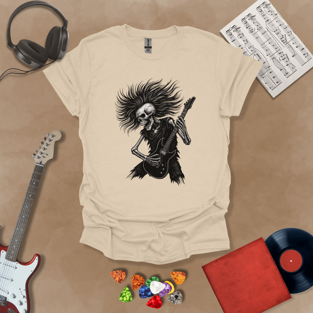 Skeleton with long hair playing guitar on a Beige shirt – hair metal rock t-shirt by Riff Junkie