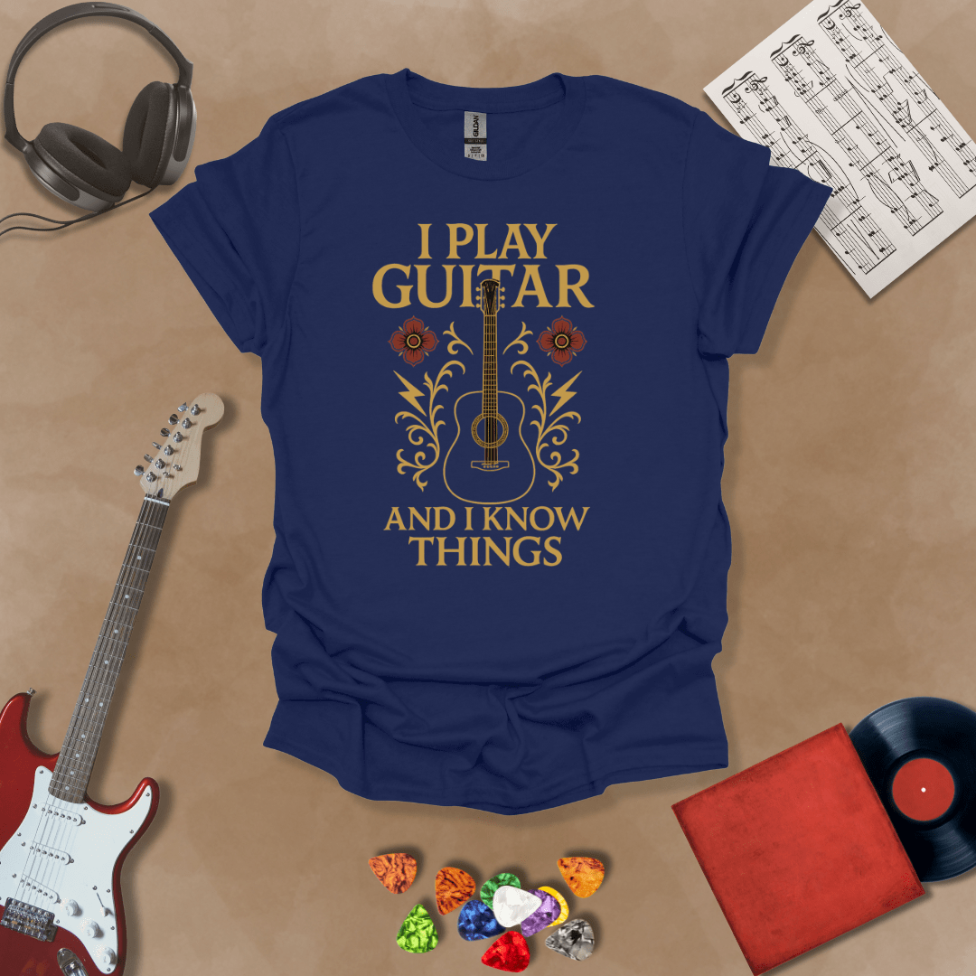 Navy t-shirt with bold medieval-inspired graphic and text “I Play Guitar and I Know Things,” blending rock style with witty humor by Riff Junkie.