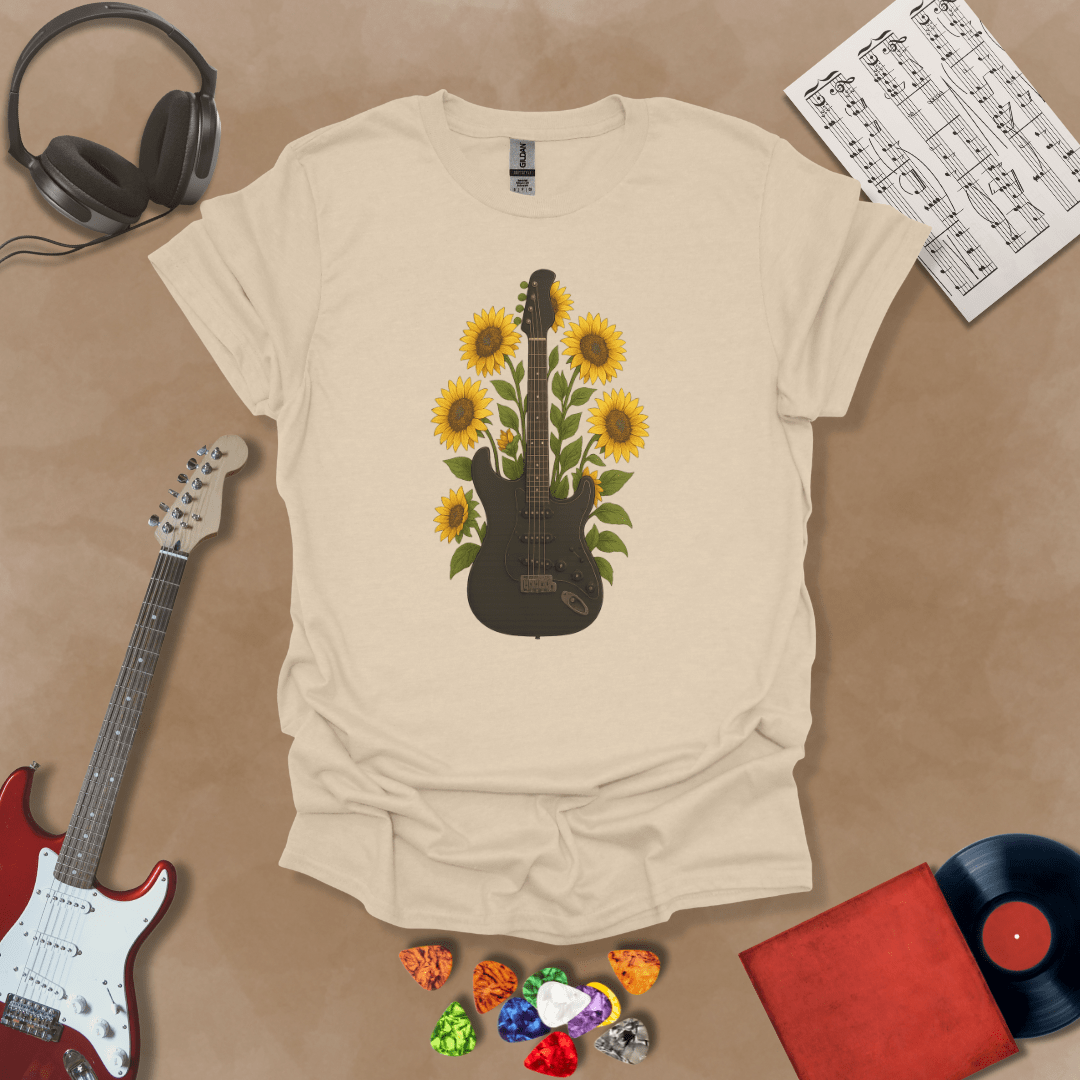 Black electric guitar surrounded by bright yellow sunflowers graphic beige t-shirt by Riff Junkie.
