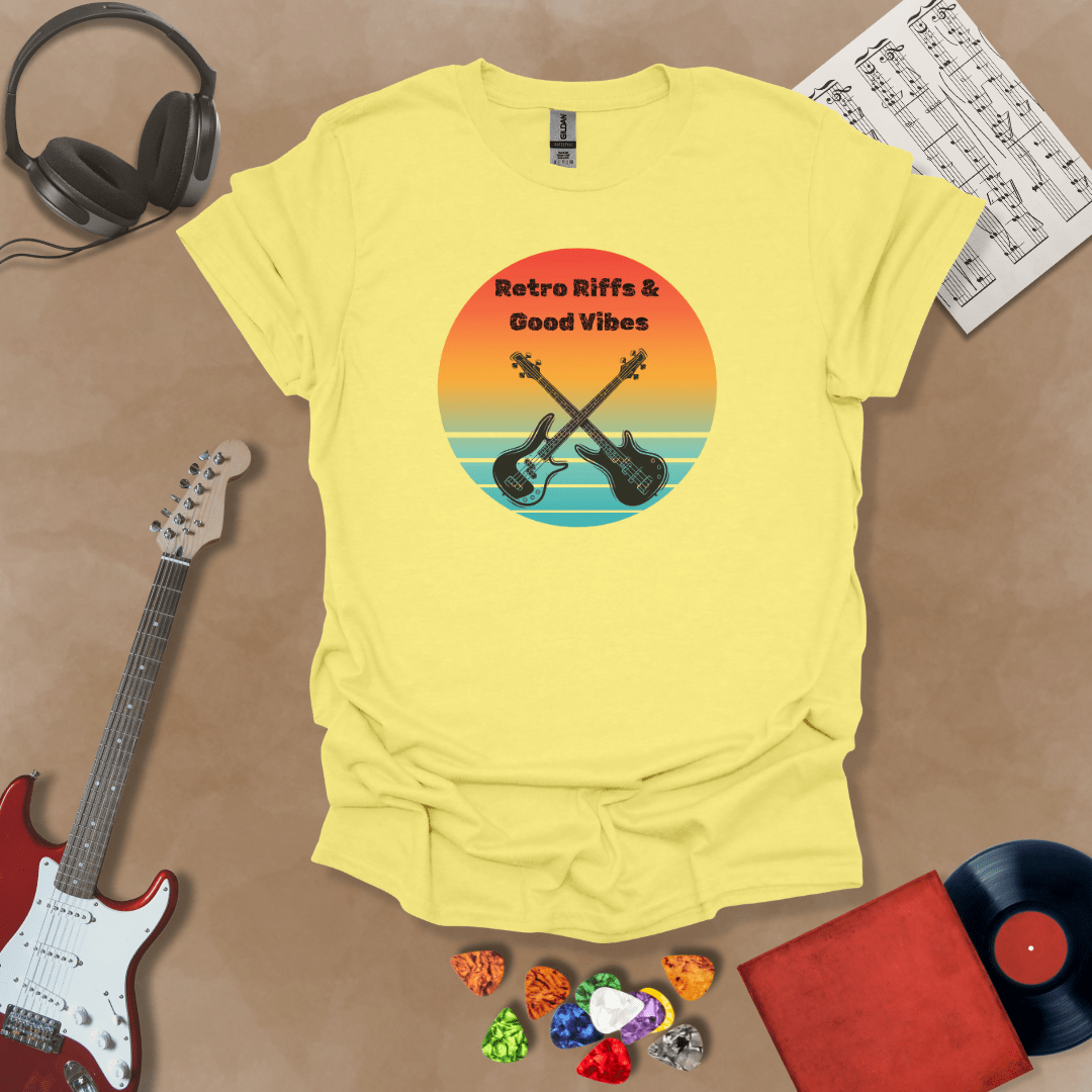Yellow t-shirt with Two guitars crossed in front of sunset, text 'Retro Riffs & Good Vibes'