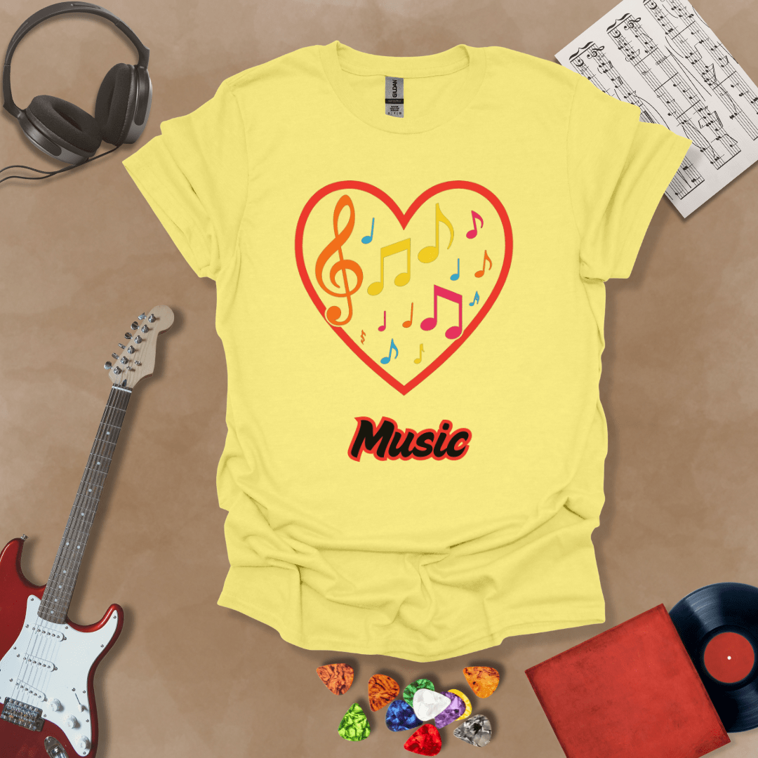 Yellow t-shirt with red heart outline filled with colorful music notes and treble clef, “Music” text below.