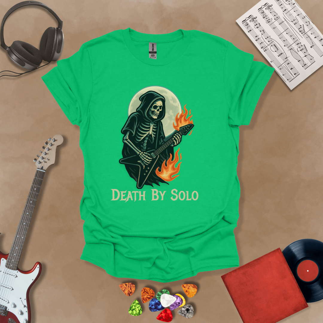 Green t-shirt with a graphic of a grim reaper skeleton playing a flaming V-style guitar under a glowing full moon, with the text “Death By Solo” below.