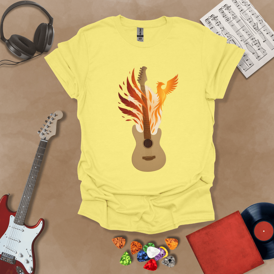 Yellow T-shirt featuring a fiery phoenix rising with wings ablaze, intertwined with a guitar, symbolizing rebirth and the eternal power of music.
