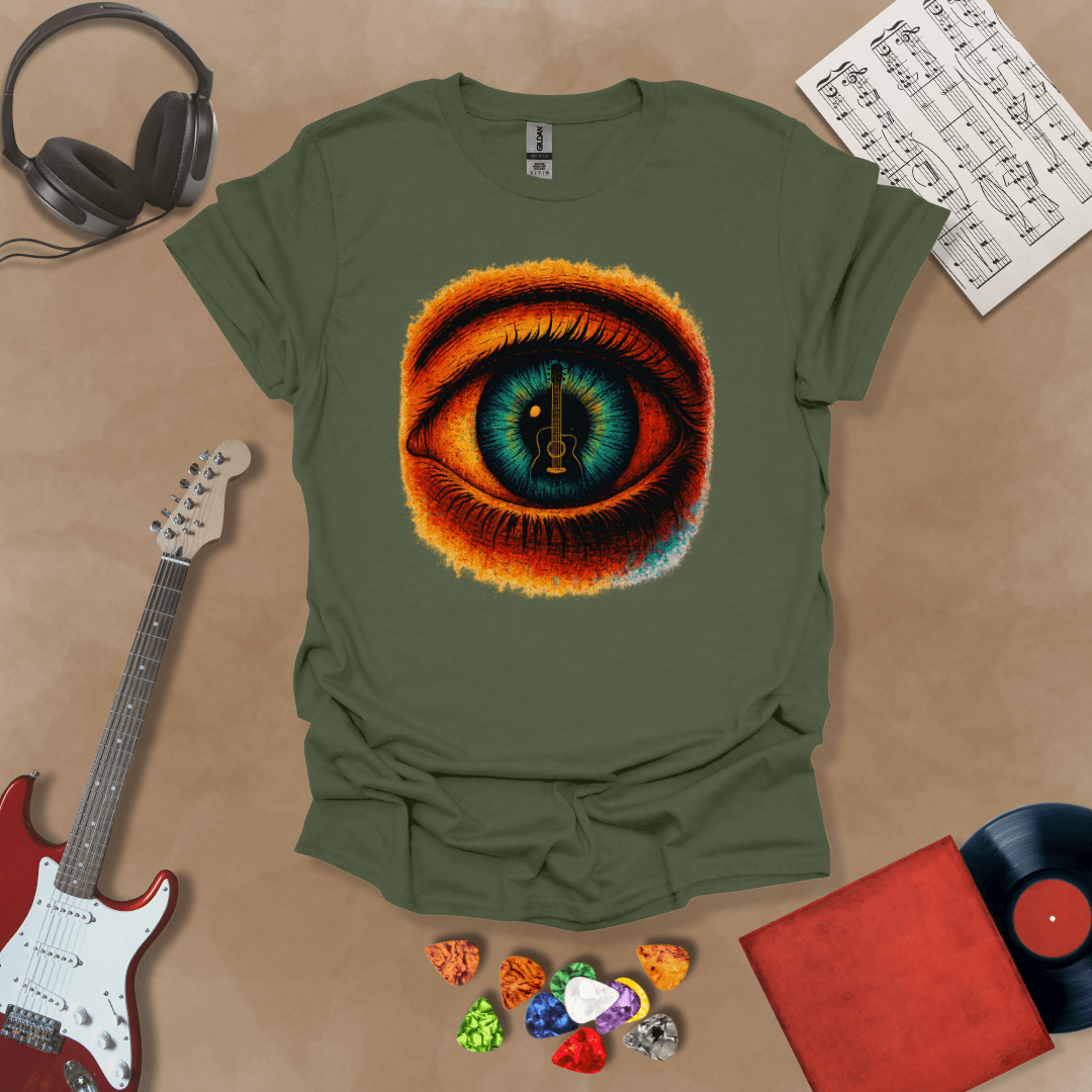 Green t-shirt featuring a fiery psychedelic eye with a glowing iris and a guitar silhouette at the center of the pupil.