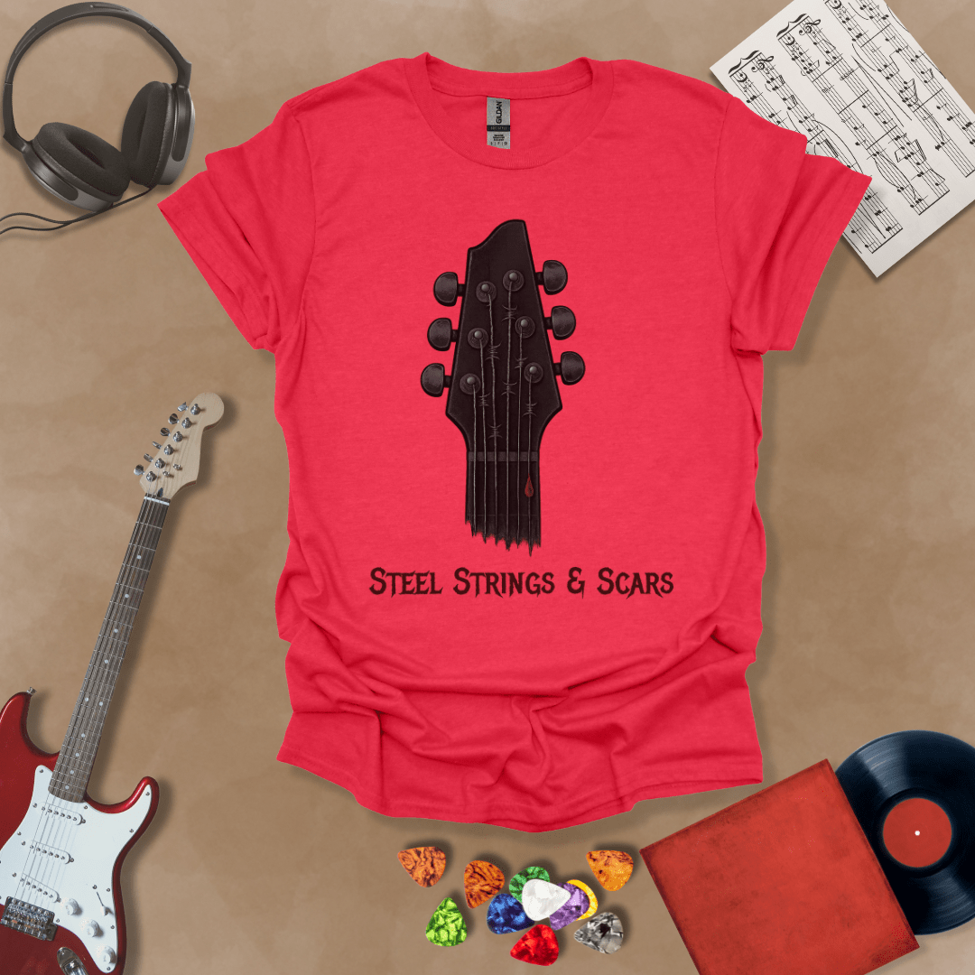 Red t-shirt featuring a guitar headstock with razor-wire steel strings and a drop of blood, with the text “Steel Strings & Scars” below.