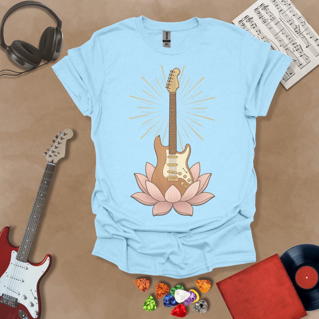 Light blue t-Shirt with Electric guitar rising from a pink lotus flower with radiant light beams, symbolic fusion of rock music and spiritual harmony.