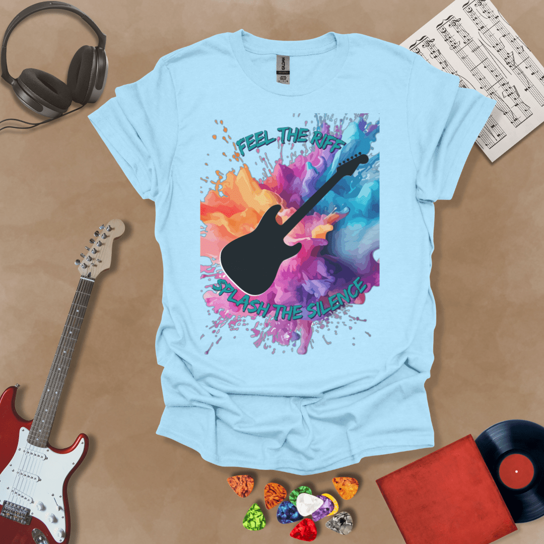 Light blue T-shirt with Bold guitar splash design with black silhouette and colorful paint burst, outlined for contrast. Text reads ‘Feel the Riff, Splash the Silence'.