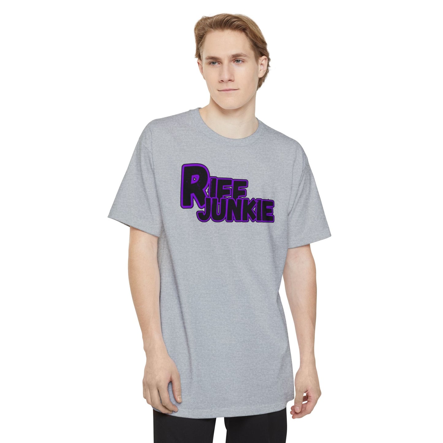 A man wearing a black Riff Junkie Logo Stage Lights Edition Tall Fit t-shirt gray featuring a glowing purple guitar-inspired logo on the front, designed with extra length for a comfortable fit.