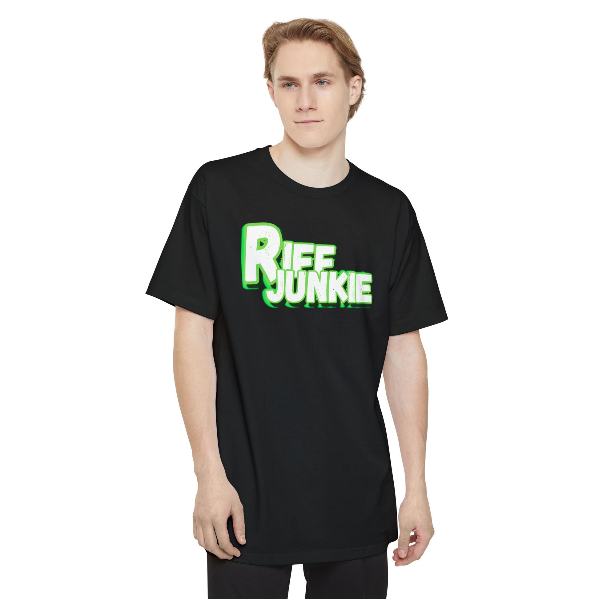 A male wearing a black short-sleeve crewneck t-shirt featuring a bold graphic on the chest that reads 'Riff Junkie' in a stylized green and white font, displayed against a solid white background.