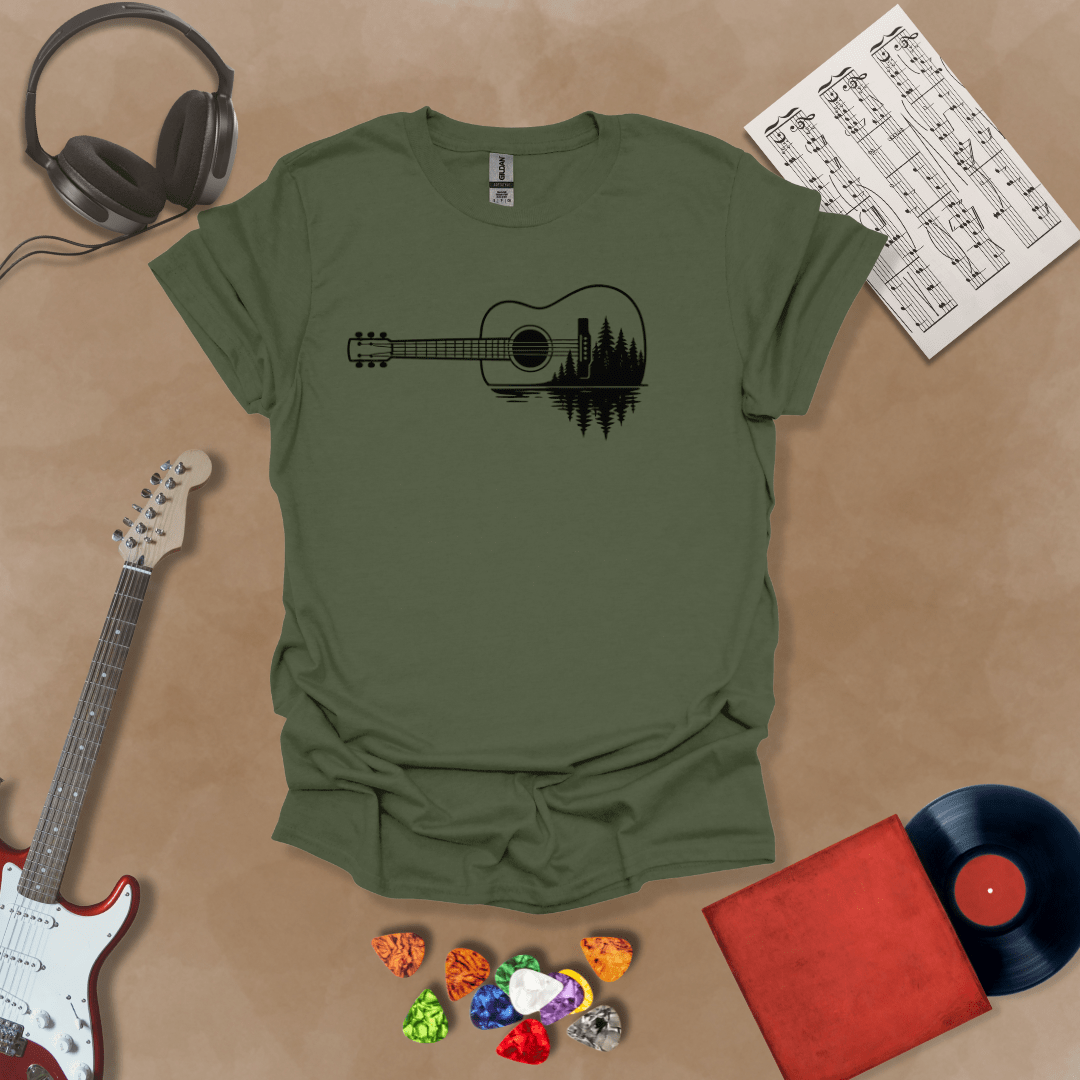 Military Green t-shirt with a black graphic of an acoustic guitar, featuring a reflection of pine trees and water inside the guitar body.