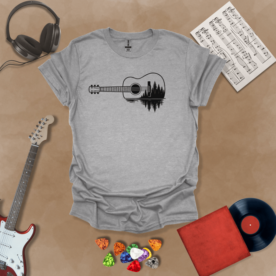Sport Grey t-shirt with a black graphic of an acoustic guitar, featuring a reflection of pine trees and water inside the guitar body.