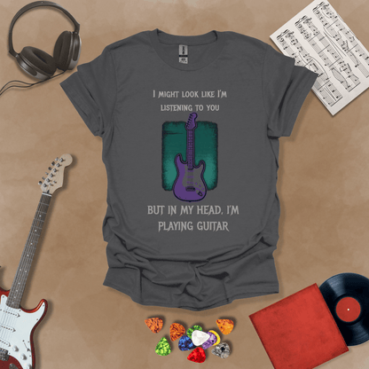 Purple electric guitar graphic with text about listening and playing guitar in head on Gray shirt by Riff Junkie.