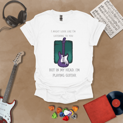 Purple electric guitar graphic with text about listening and playing guitar in head on White shirt by Riff Junkie.