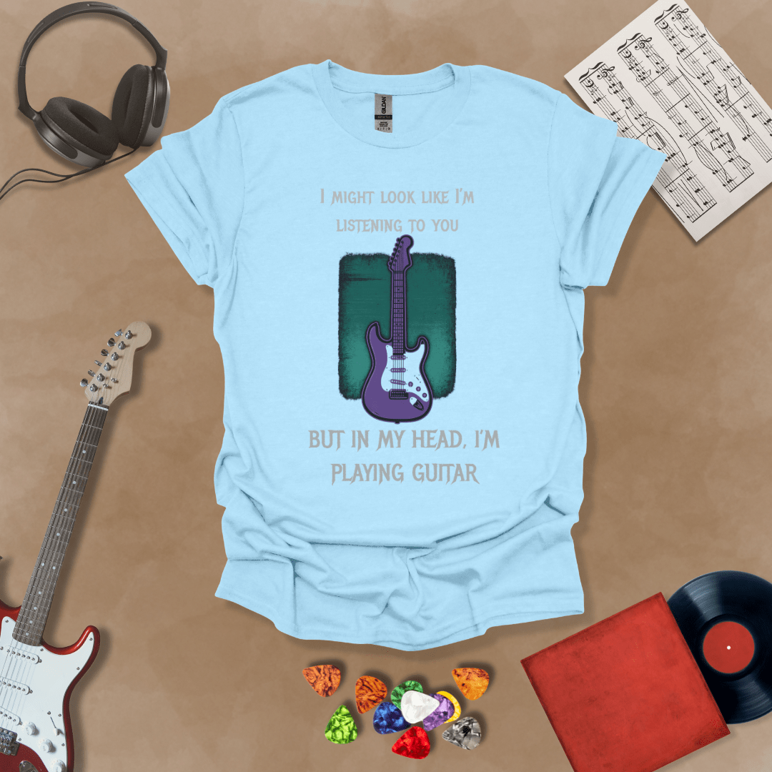 Purple electric guitar graphic with text about listening and playing guitar in head on Light Blue shirt by Riff Junkie.