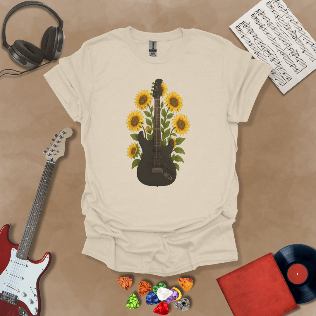 Black electric guitar surrounded by bright yellow sunflowers graphic beige t-shirt by Riff Junkie.