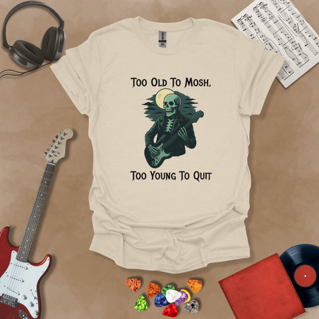 Beige  t-shirt with Skeleton guitarist under moonlight with text 'Too old to mosh, too young to quit'