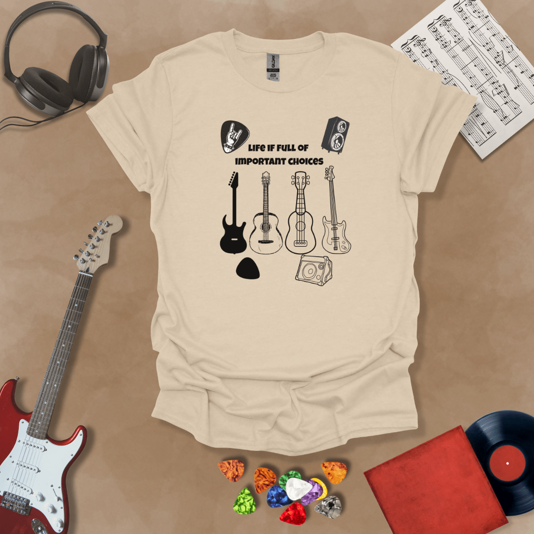 Beige t-shirt with Row of guitars and picks with text 'Life is full of important choices'