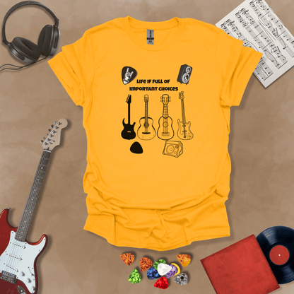 Yellow t-shirt with Row of guitars and picks with text 'Life is full of important choices'