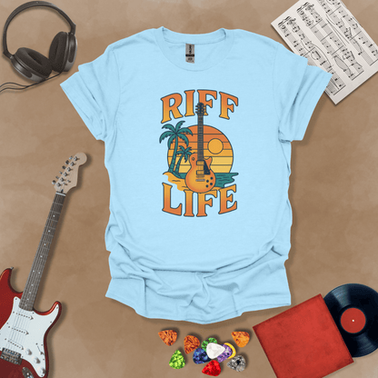 Light Blue t-shirt with Sunset beach with palm trees and guitar, text 'Riff Life'