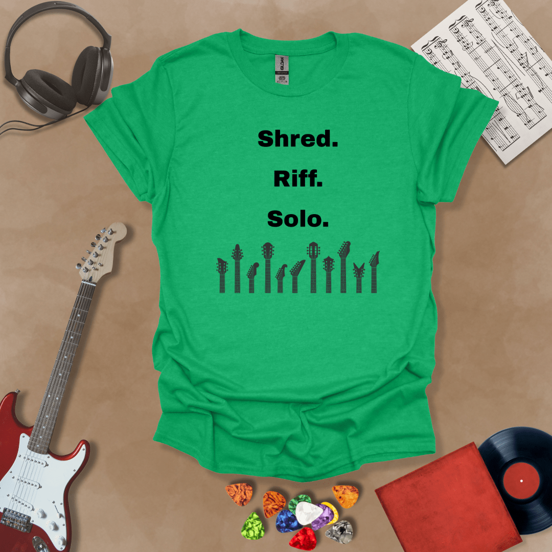 Green T-shirt with text 'Shred. Riff. Solo.' with row of guitar headstocks silhouette