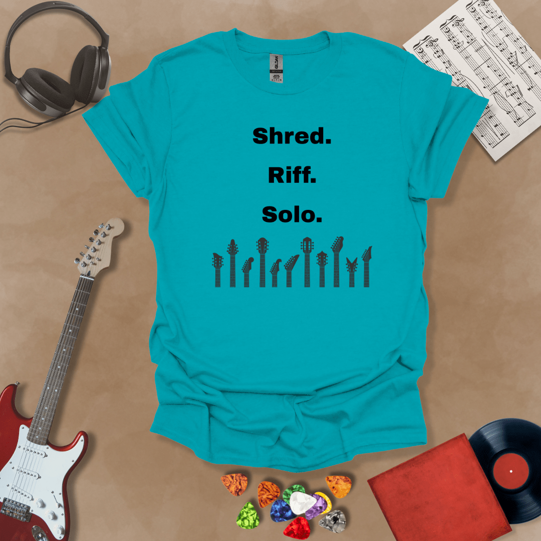 Blue T-shirt with text 'Shred. Riff. Solo.' with row of guitar headstocks silhouette