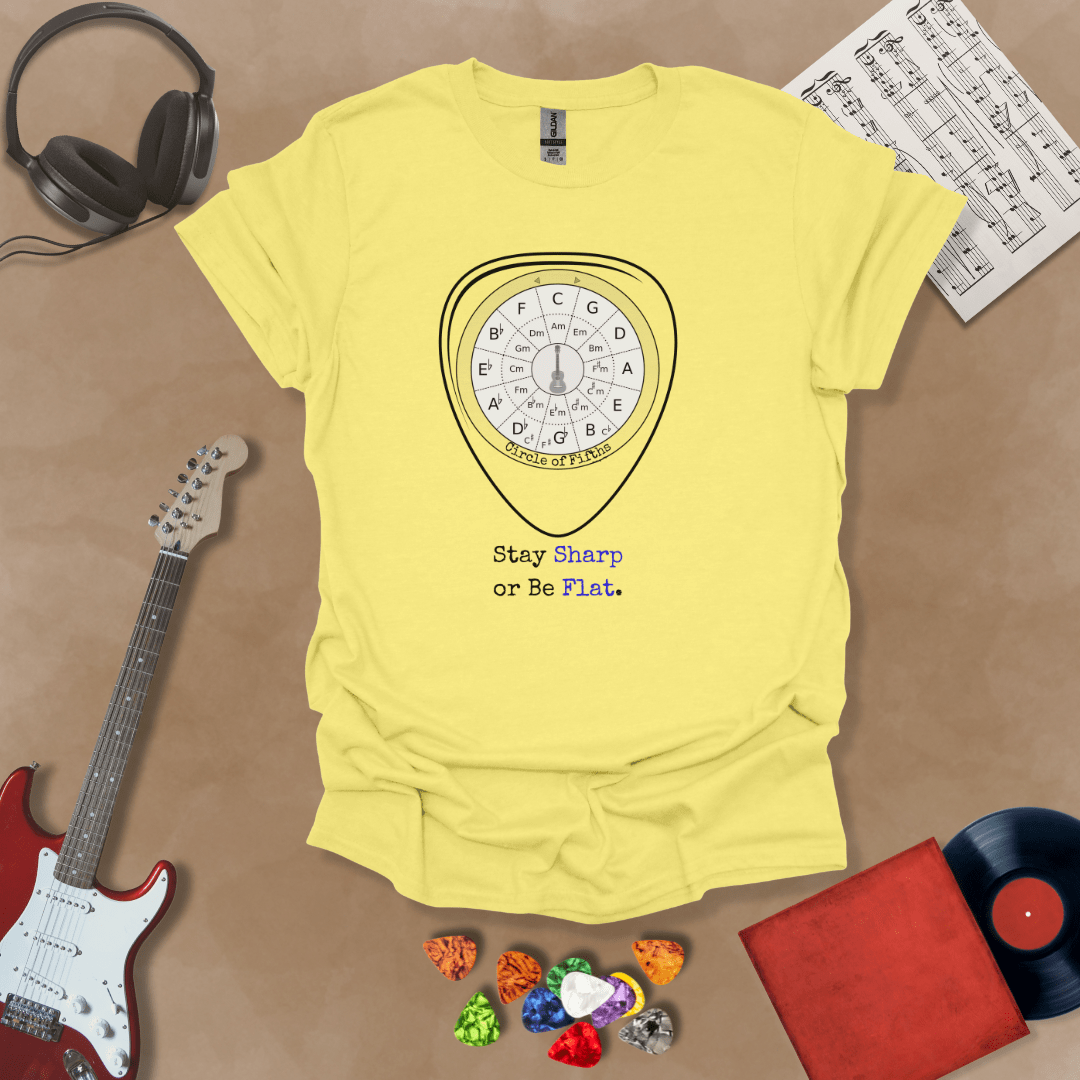 Yellow t-shirt with Circle of fifths chart inside guitar pick, text 'Stay sharp or be flat'
