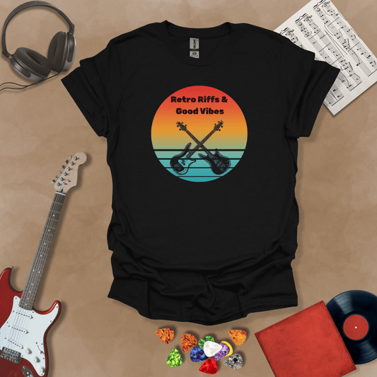 Black t-shirt with Two guitars crossed in front of sunset, text 'Retro Riffs & Good Vibes'