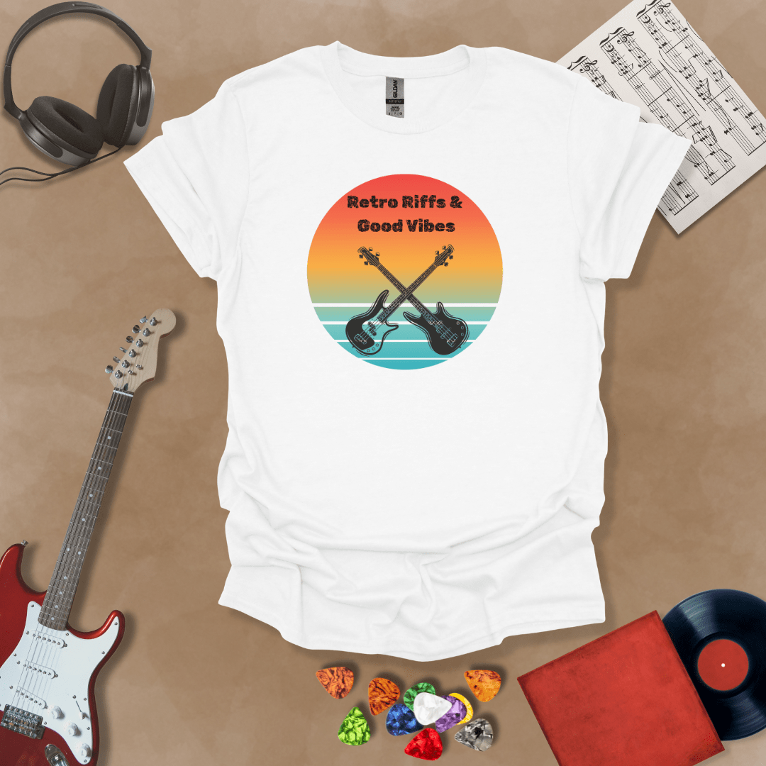 White t-shirt with Two guitars crossed in front of sunset, text 'Retro Riffs & Good Vibes'