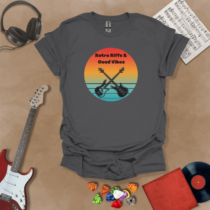 Gray t-shirt with Two guitars crossed in front of sunset, text 'Retro Riffs & Good Vibes'