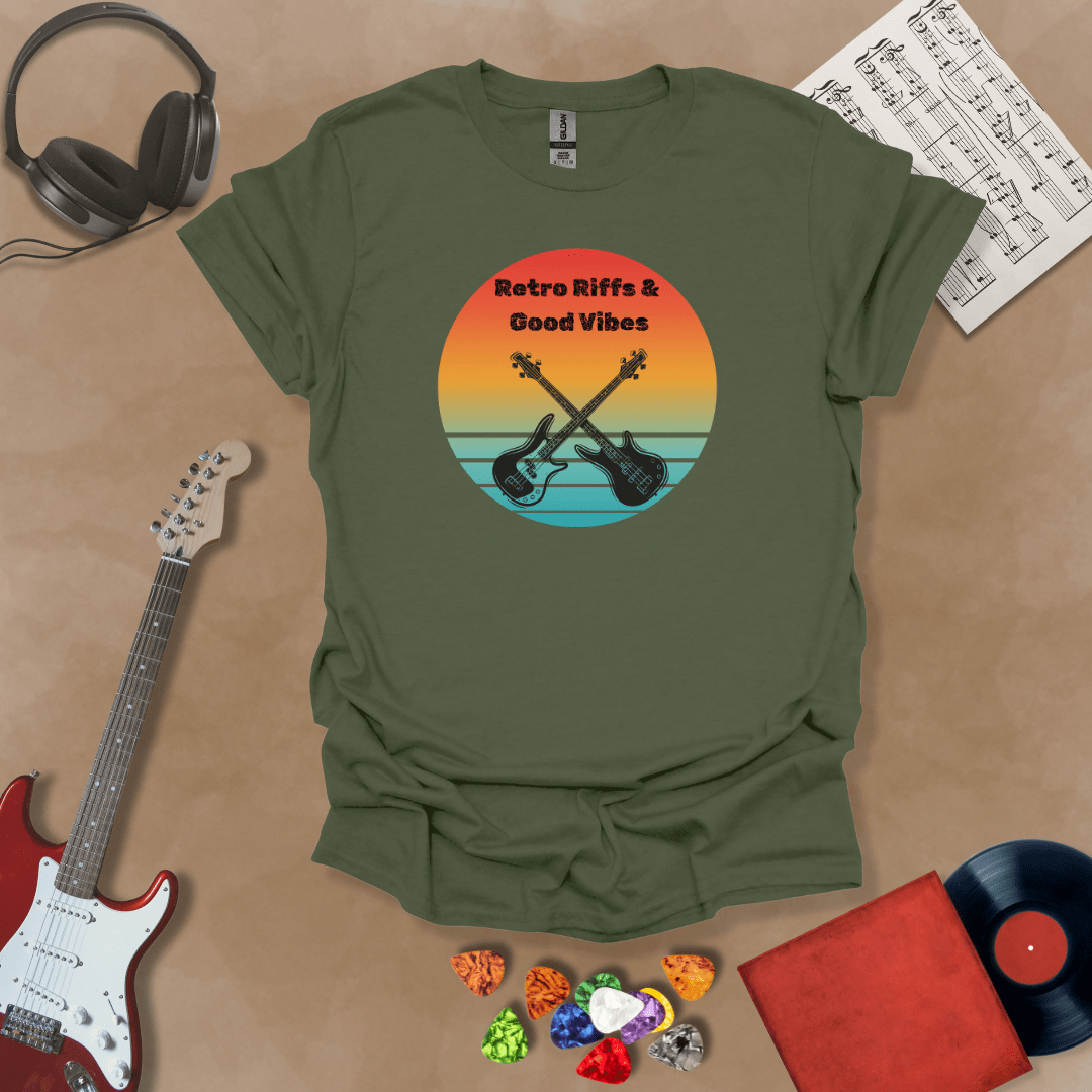 Green t-shirt with Two guitars crossed in front of sunset, text 'Retro Riffs & Good Vibes'