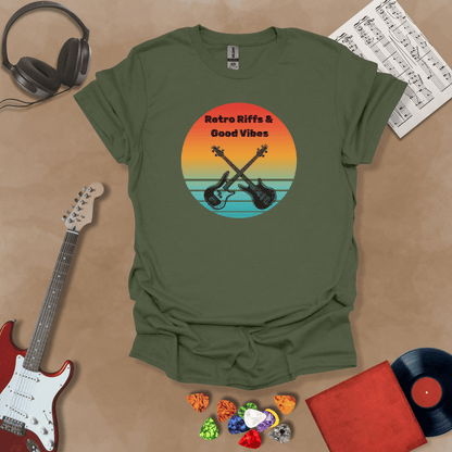 Green t-shirt with Two guitars crossed in front of sunset, text 'Retro Riffs & Good Vibes'