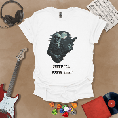White t-shirt with Skeleton guitarist with moonlight, text 'Shred Til You're Dead'