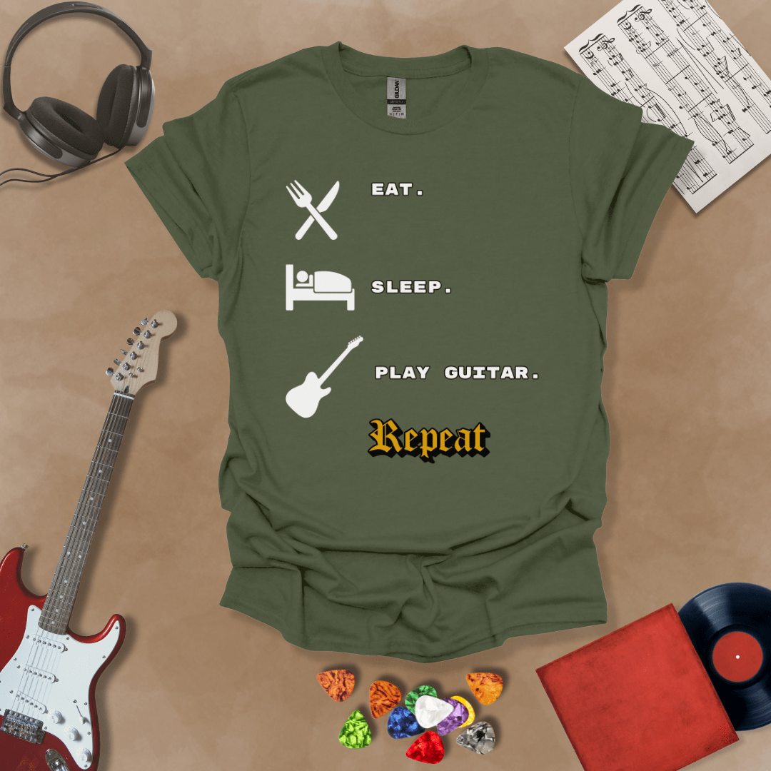 Green t-shirt with 'Eat. Sleep. Play Guitar. Repeat.' text and graphics 
