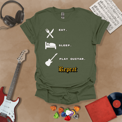 Green t-shirt with 'Eat. Sleep. Play Guitar. Repeat.' text and graphics 