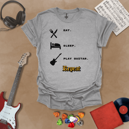 Gray t-shirt with 'Eat. Sleep. Play Guitar. Repeat.' text and graphics 