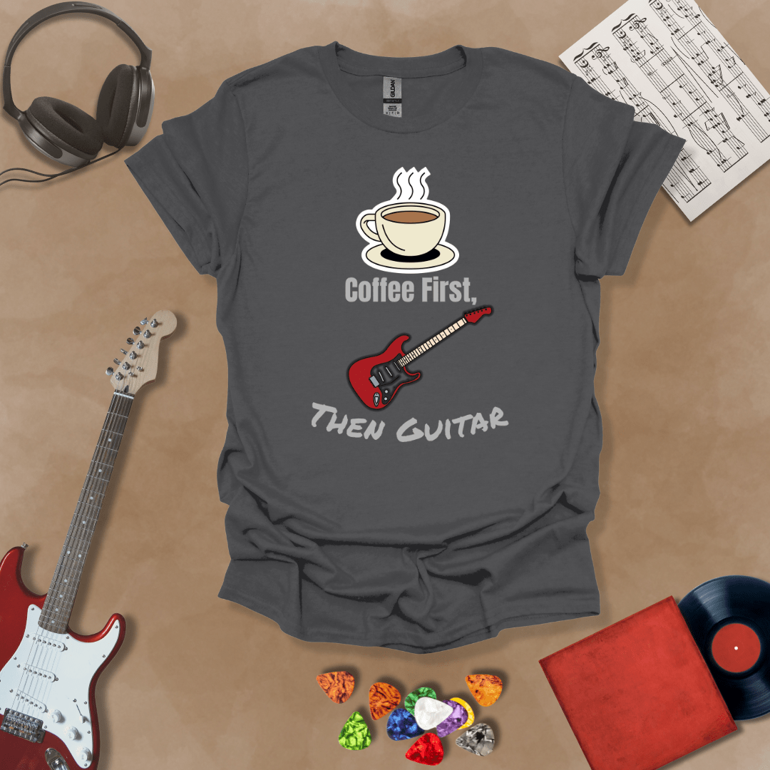 Gray T-shirt design with steaming coffee cup illustration transforming into guitar strings, text “Coffee First, Then Guitar.”