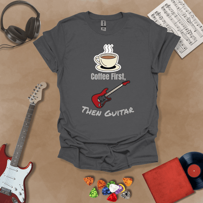 Gray T-shirt design with steaming coffee cup illustration transforming into guitar strings, text “Coffee First, Then Guitar.”