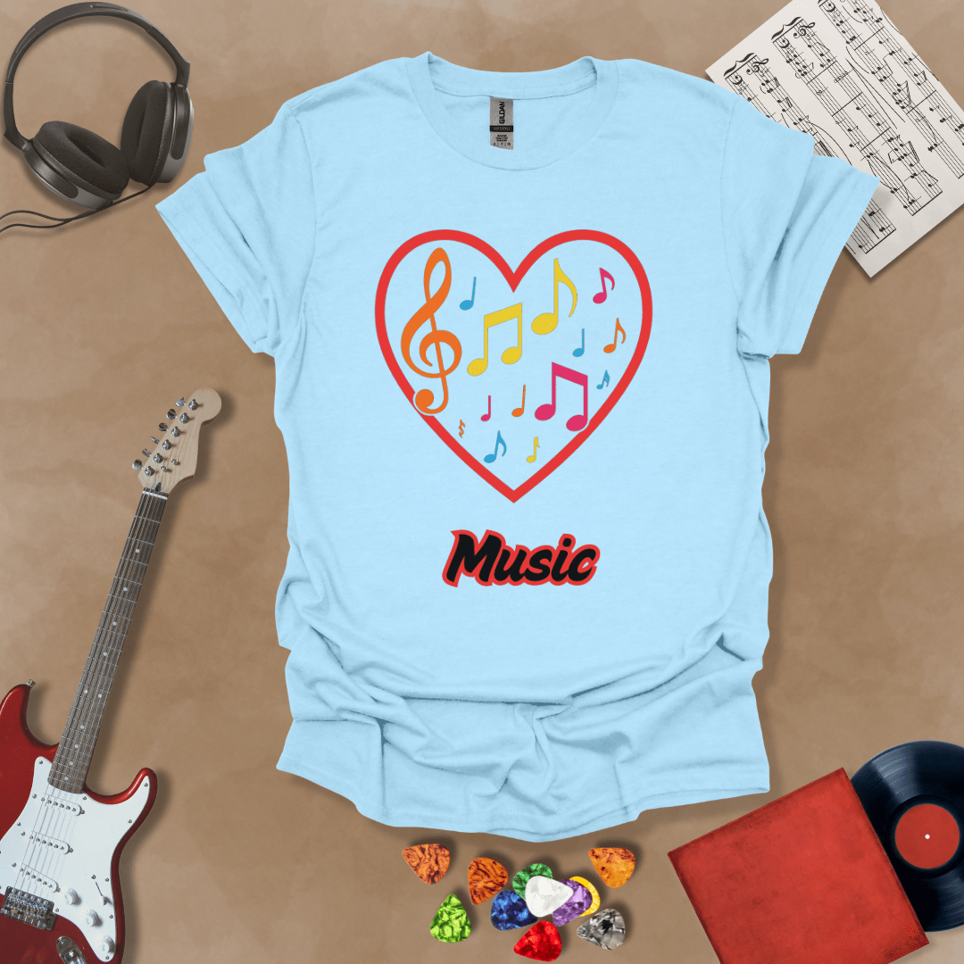 Light Blue t-shirt with red heart outline filled with colorful music notes and treble clef, “Music” text below.