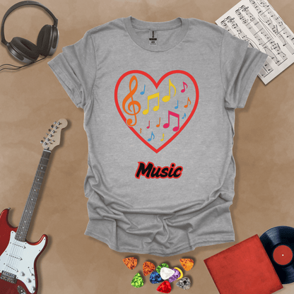 Gray t-shirt with red heart outline filled with colorful music notes and treble clef, “Music” text below.