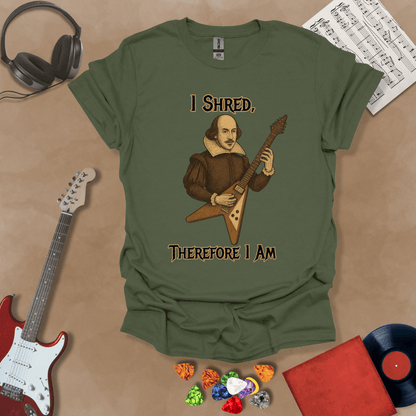 Medieval-inspired green t-shirt with bold lettering “I Shred, Therefore I Am” and guitar art.