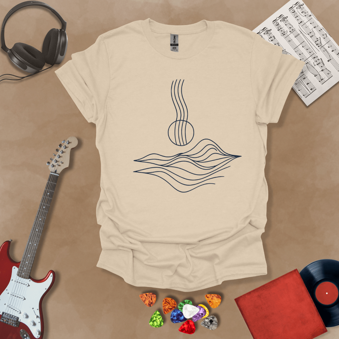 Beige t-shirt with minimalist abstract line art resembling guitar strings flowing into wave-like shapes.