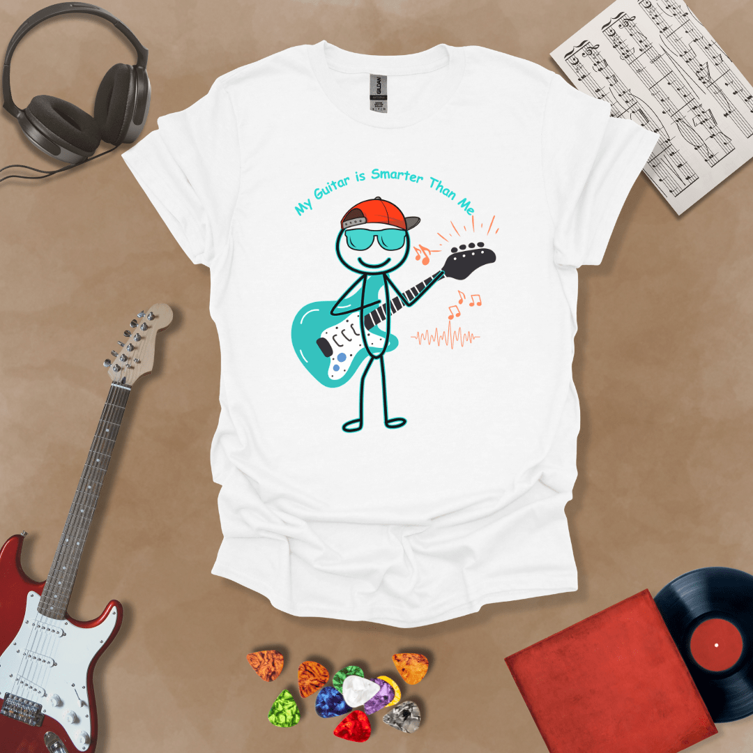 White t-shirt with cartoon stick figure wearing hat and sunglasses, holding teal guitar, text “My Guitar is Smarter Than Me.”
