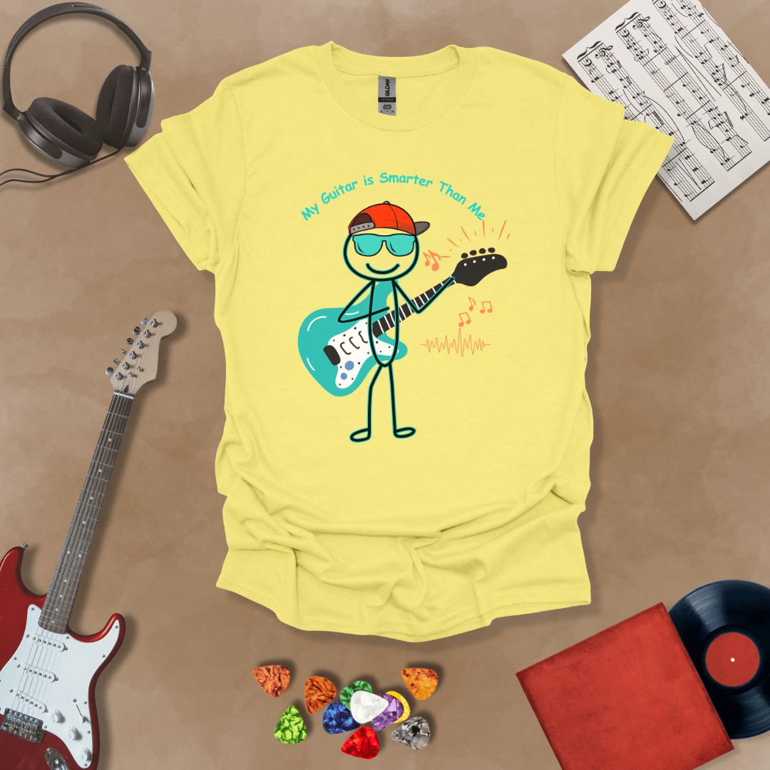 Yellow t-shirt with cartoon stick figure wearing hat and sunglasses, holding teal guitar, text “My Guitar is Smarter Than Me.”
