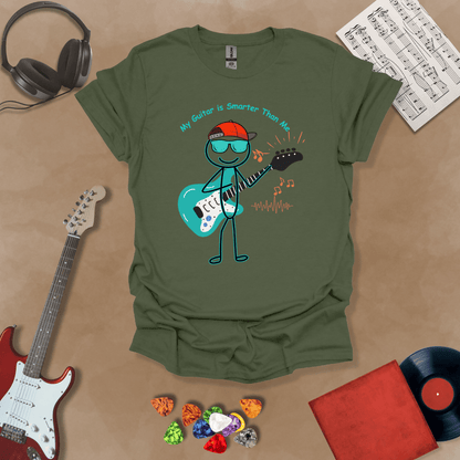 Green t-shirt with cartoon stick figure wearing hat and sunglasses, holding teal guitar, text “My Guitar is Smarter Than Me.”
