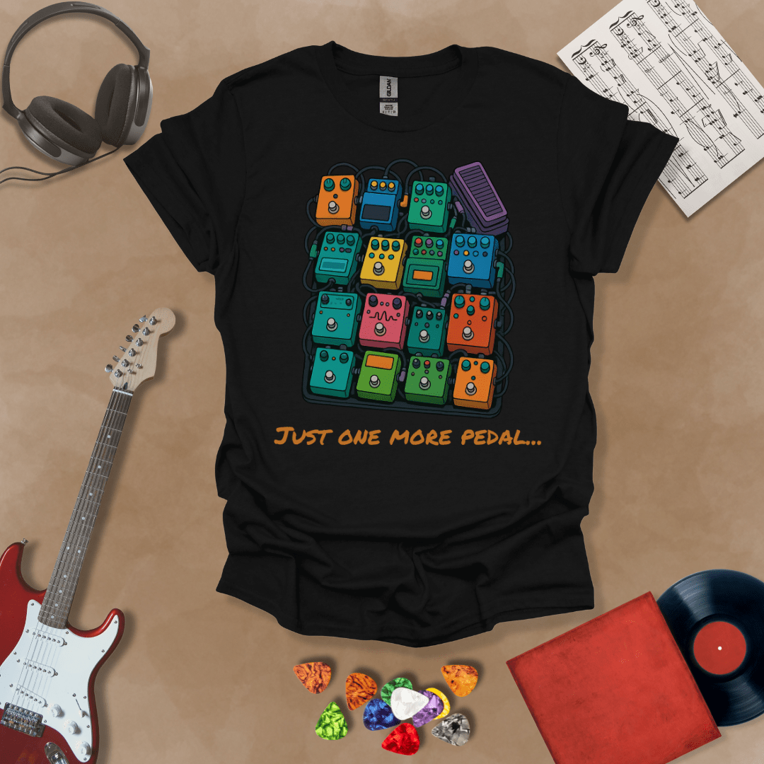 Black t-shirt with graphic of multiple guitar pedals, text “Just One More Pedal.”
