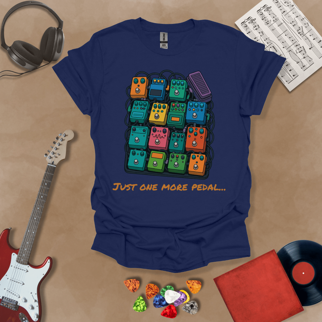 Navy t-shirt with graphic of multiple guitar pedals, text “Just One More Pedal.”