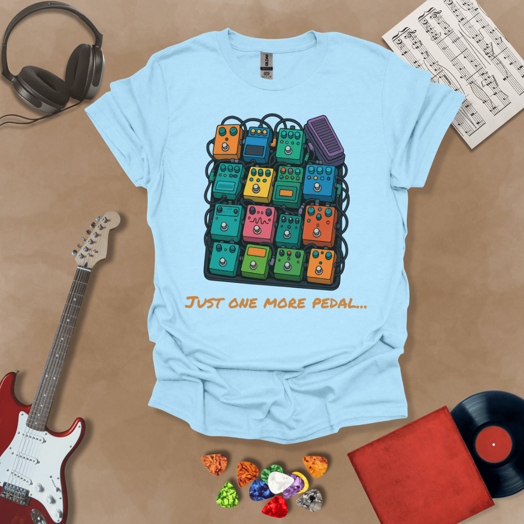 Light blue t-shirt with graphic of multiple guitar pedals, text “Just One More Pedal.”