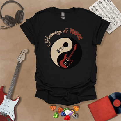 Black t-shirt with yin-yang design made from an acoustic and electric guitar, text “Harmony & Havoc.”