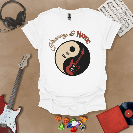 White t-shirt with yin-yang design made from an acoustic and electric guitar, text “Harmony & Havoc.”

